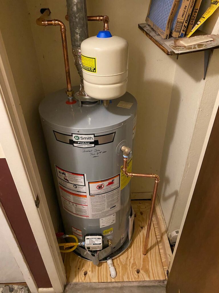 A new 50 gallon AO Smith gray water heater with an expansion tank in a closet.